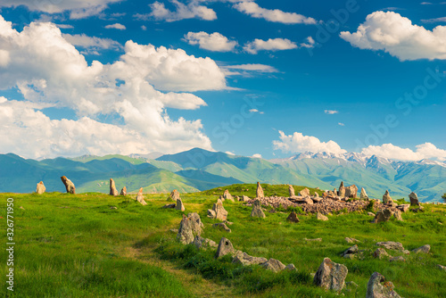 Fototapeta Naklejka Na Ścianę i Meble -  Stones of Zorats Karer in Karaunja on the background of the beautiful mountains of Armenia, summer landscape
