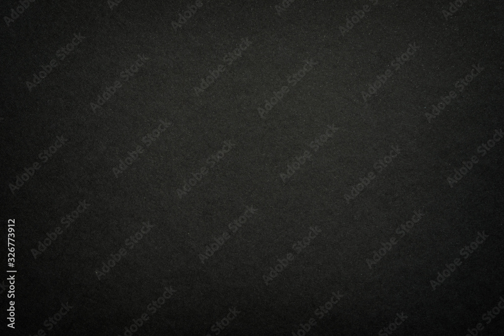 Black matte paper texture background. Surface of abstract dark texture. Gray blank page background flat close up view.