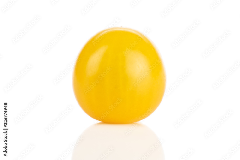 One whole fresh yellow tomato isolated on white background One whole fresh yellow tomato isolated on white background