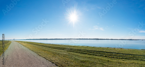 Photography Asphalt walk along bank of Gabcikovo Dam on sunny day - panoramic