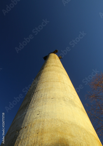 Conceptual low angle view of concrete pillar of the out of operation Norsjo aerial tramway photo