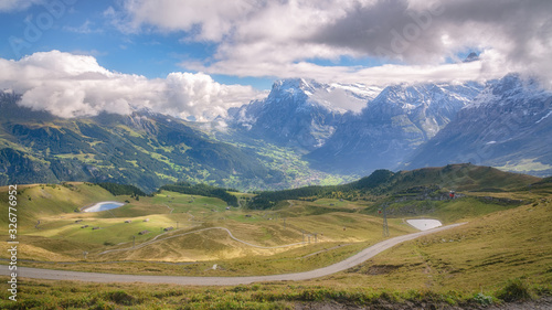 Panoramic view of Grindelwald from Mannlichen with Eiger, Monch and Jungfrau mountain (Swiss Alps) in the background, Berner Oberland, Grindelwald, Switzerland. © Fominayaphoto