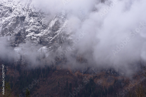 Detail of mountain face with rocks, snow and trees, in Styria region, Austria © Aron M  - Austria