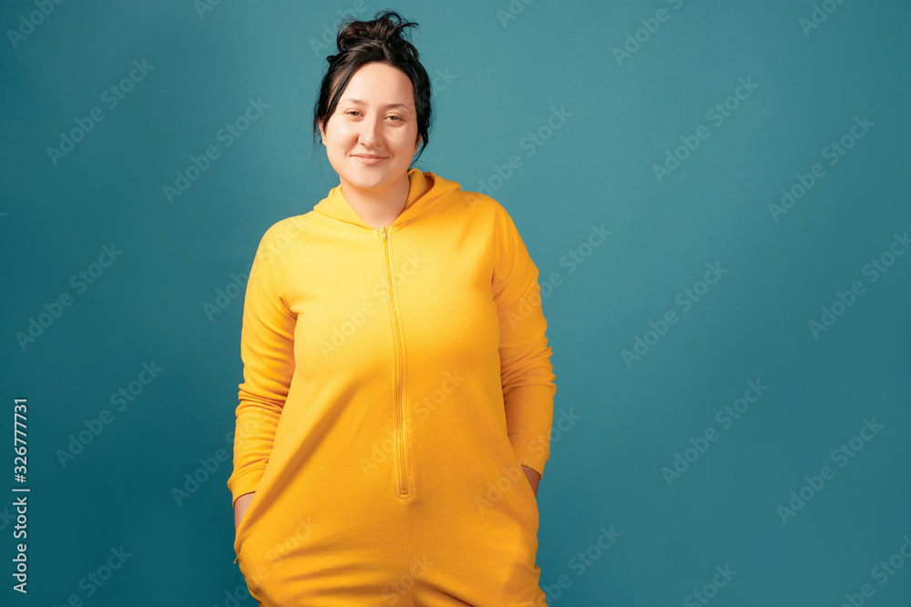 Happy plus size positive woman. Happy body positive concept. I love my body. Attractive overweight woman dressed in a yellow suit fun posing for the camera Happy plus size positive woman. Happy body positive concept. I love my body. Attractive overweight woman dressed in a yellow suit fun posing for the camera