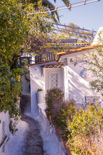 Fototapeta Naklejka Na Ścianę i Meble -  Architectural details from the narrow streets of Plaka, a traditional neighborhood in Athens, on the slopes of Acropolis, Greece
