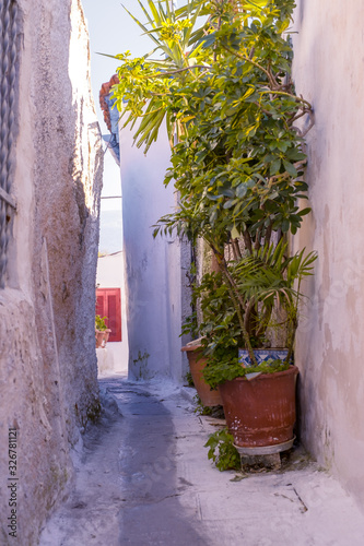 Fototapeta Naklejka Na Ścianę i Meble -  Architectural details from the narrow streets of Plaka, a traditional neighborhood in Athens, on the slopes of Acropolis, Greece