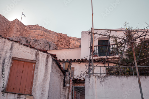 Fototapeta Naklejka Na Ścianę i Meble -  Architectural details from the narrow streets of Plaka, a traditional neighborhood in Athens, on the slopes of Acropolis, Greece