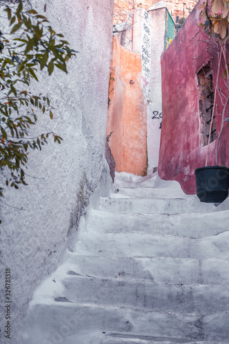 Fototapeta Naklejka Na Ścianę i Meble -  Architectural details from the narrow streets of Plaka, a traditional neighborhood in Athens, on the slopes of Acropolis, Greece