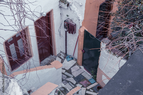 Fototapeta Naklejka Na Ścianę i Meble -  Architectural details from the narrow streets of Plaka, a traditional neighborhood in Athens, on the slopes of Acropolis, Greece