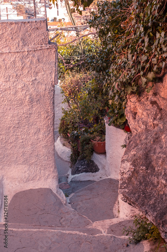 Fototapeta Naklejka Na Ścianę i Meble -  Architectural details from the narrow streets of Plaka, a traditional neighborhood in Athens, on the slopes of Acropolis, Greece