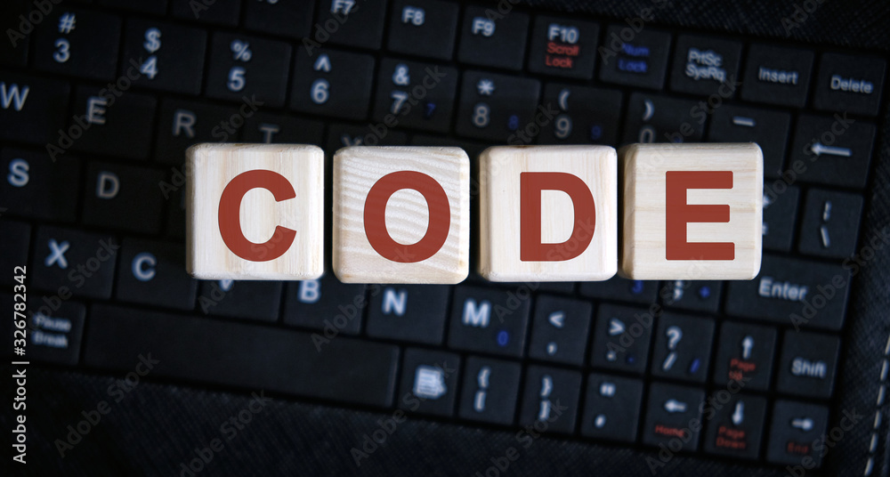 Code word concept on cubes on the keyboard Code word concept on cubes on the keyboard