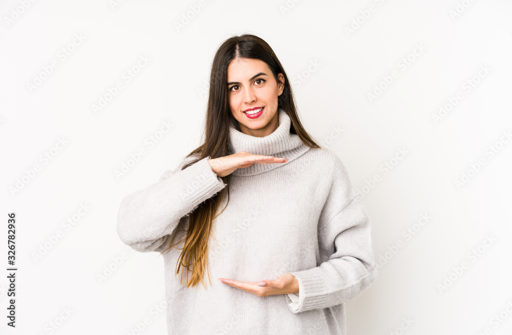 Young caucasian woman isolated on a white background holding something with both hands, product presentation. Young caucasian woman isolated on a white background holding something with both hands, product presentation.