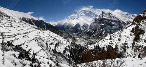 Annapurna Circuit track. View at Anapurna and Ghyaru village. photo