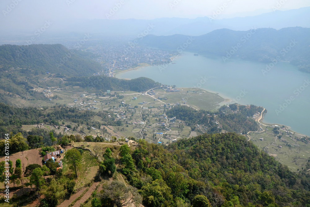 Aerial view from the paraglider at Phewa Lake and surrounding villages. Pokhara town, Nepal.