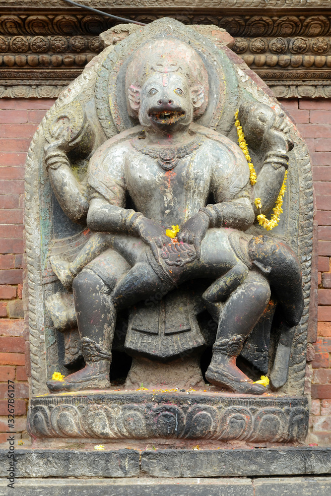 Statue of Narasimhadeva is located at the main entrance to Sundari Chowk and the royal palace of Patan. Durbar square, Lalitpur, Nepal.