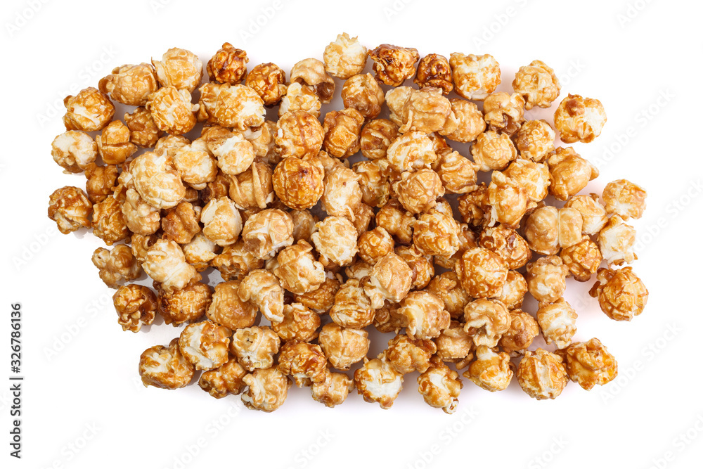 Heap of delicious caramel popcorn, isolated on white background . Scattered popcorn texture background. Heap of delicious caramel popcorn, isolated on white background . Scattered popcorn texture background.