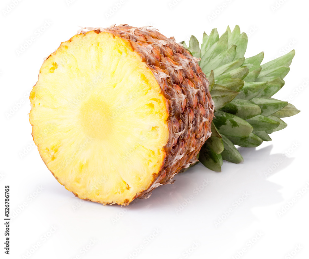 Half ripe pineapple lying horizontally isolated on white background Half ripe pineapple lying horizontally isolated on white background