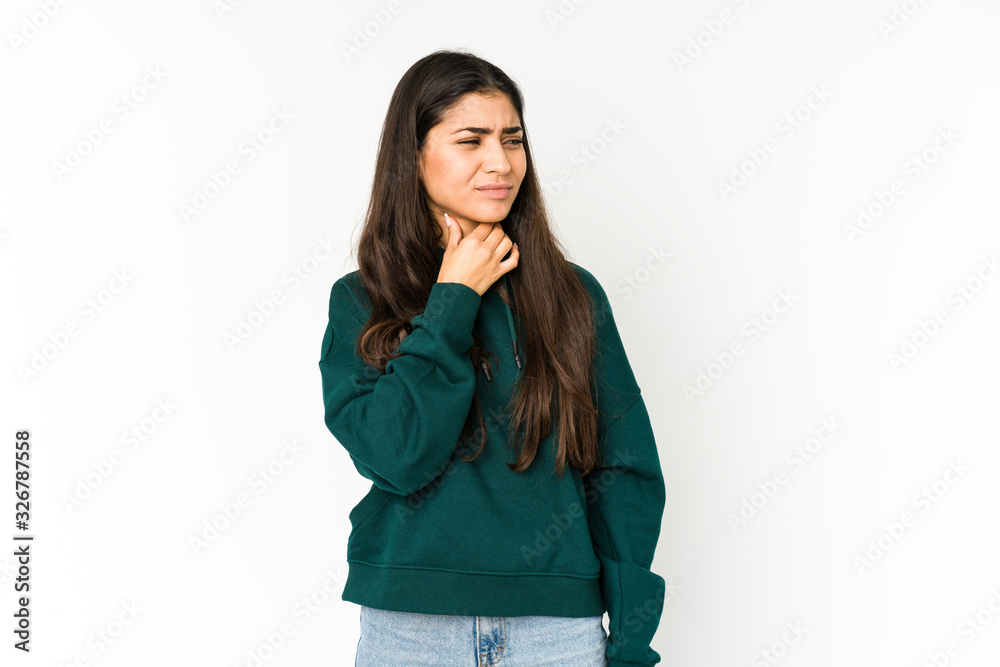 Young indian woman isolated on purple background suffers pain in throat due a virus or infection. Young indian woman isolated on purple background suffers pain in throat due a virus or infection.