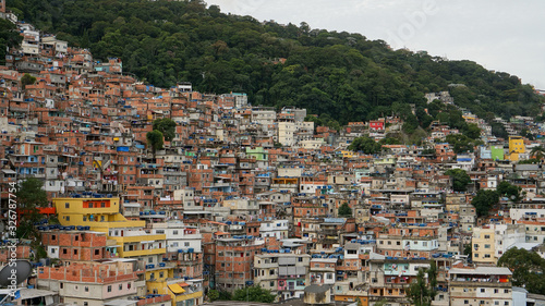 Rocinha is the largest favela in Brazil, located in Rio de Janeiro's South Zone between the districts of São Conrado and Gavea. 