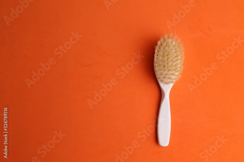 white hairbrush in color background
