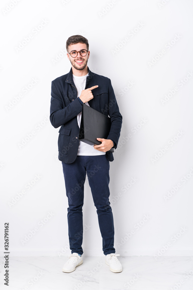 Young caucasian man full body isolated smiling cheerfully pointing with forefinger away. Young caucasian man full body isolated smiling cheerfully pointing with forefinger away.