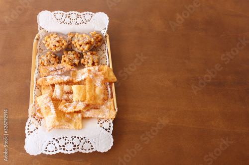 chiacchiere e struffoli di carnevale photo