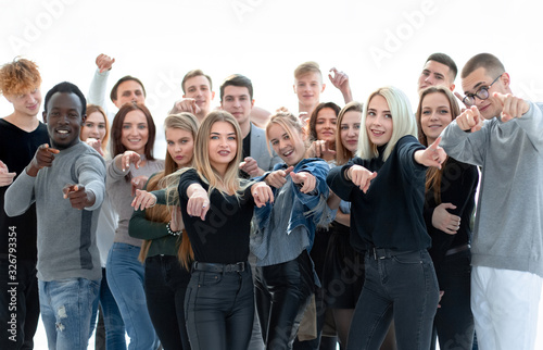 group of confident young people pointing at you
