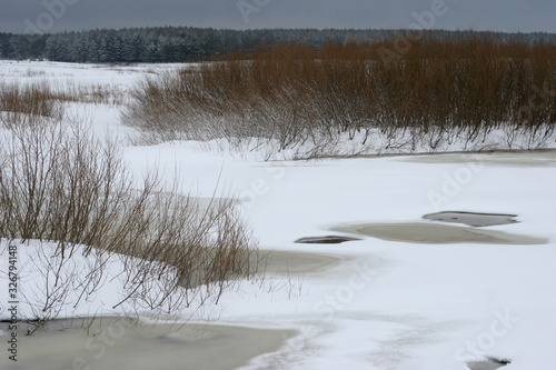 frozen river under ice and snow photo