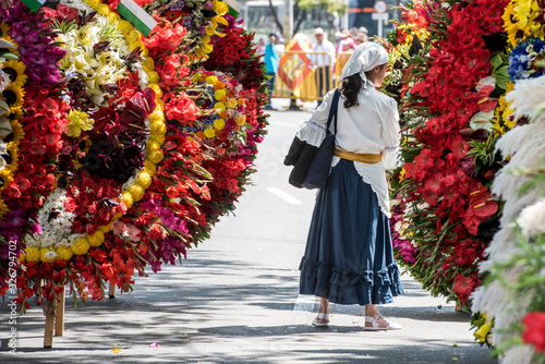 Medellin, Antioquia, Colombia August 7, 2016: Parade of silleteros on a sunny day at the Flower Fair photo