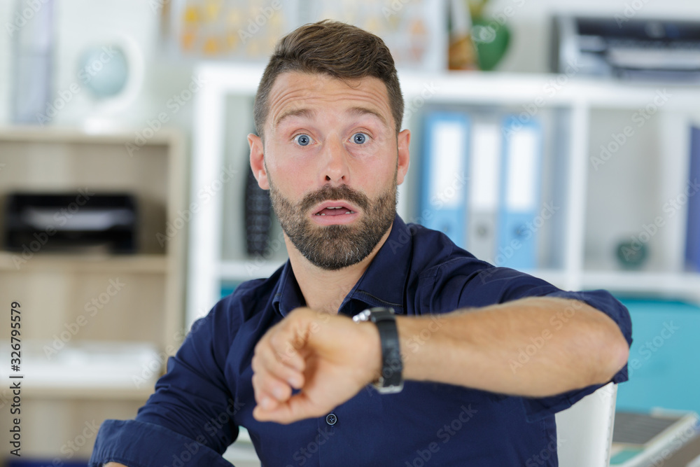 Naklejka premium a worried man checking time