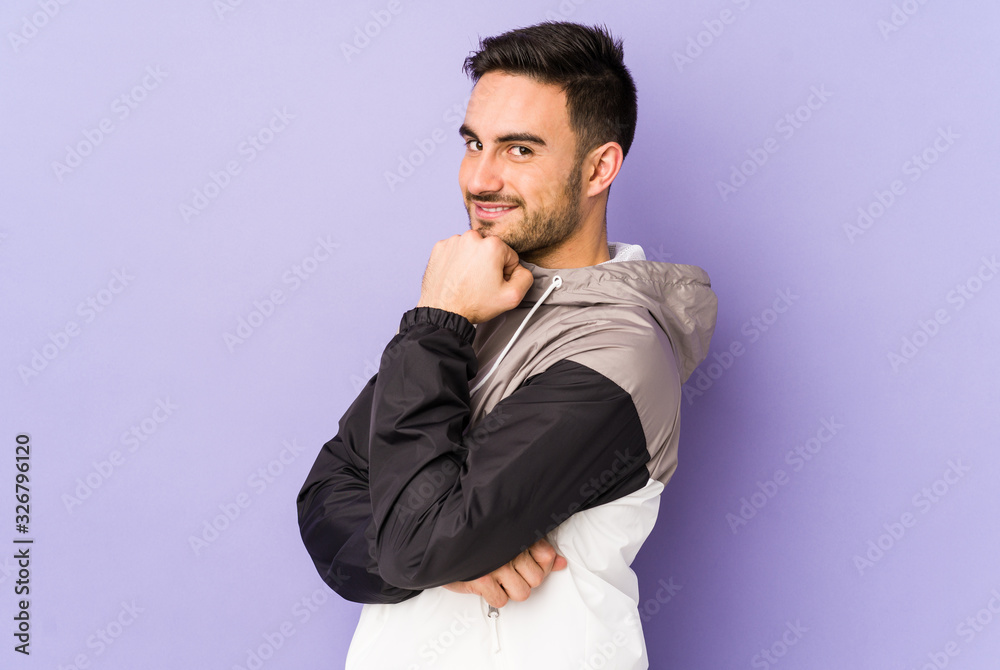 Young caucasian man isolated on purple background smiling happy and confident, touching chin with hand. Young caucasian man isolated on purple background smiling happy and confident, touching chin with hand.