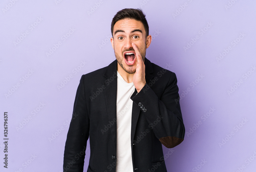 Young caucasian man isolated on purple background is saying a secret hot braking news and looking aside Young caucasian man isolated on purple background is saying a secret hot braking news and looking aside