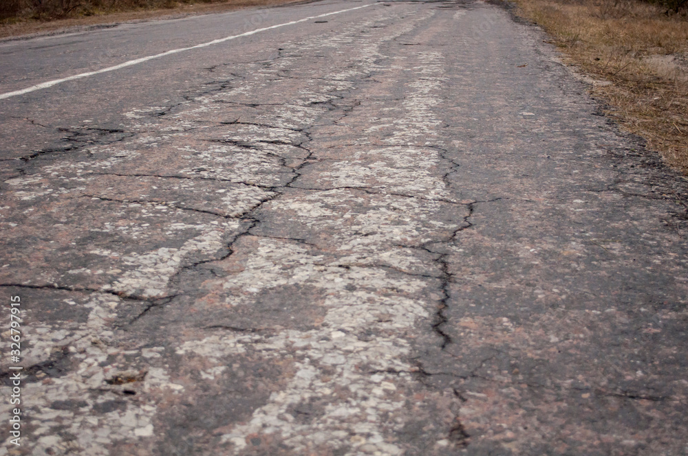 Naklejka premium bad, destroyed asphalt