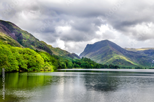 A view of Fleetwith Pike by Grasmere with storm clouds gathering over a fell in the Lake District.