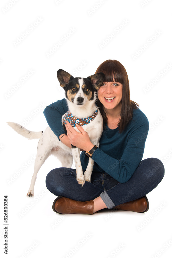 Young woman hugs her dog