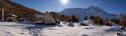 Принти на полотні Snowy village located in the French Alps with a blue sky