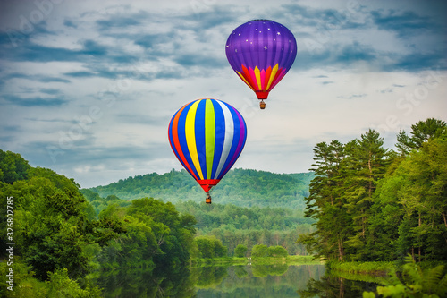two hot air balloons over Dewey's Pond Quechee Vermont.jpg