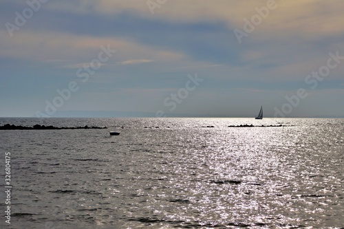Panoramic view of a sailboat sailing near the coast of Alicante in the Mediterranean Sea © Julio