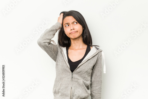 Young fitness chinese woman being shocked, she has remembered important meeting. © Asier