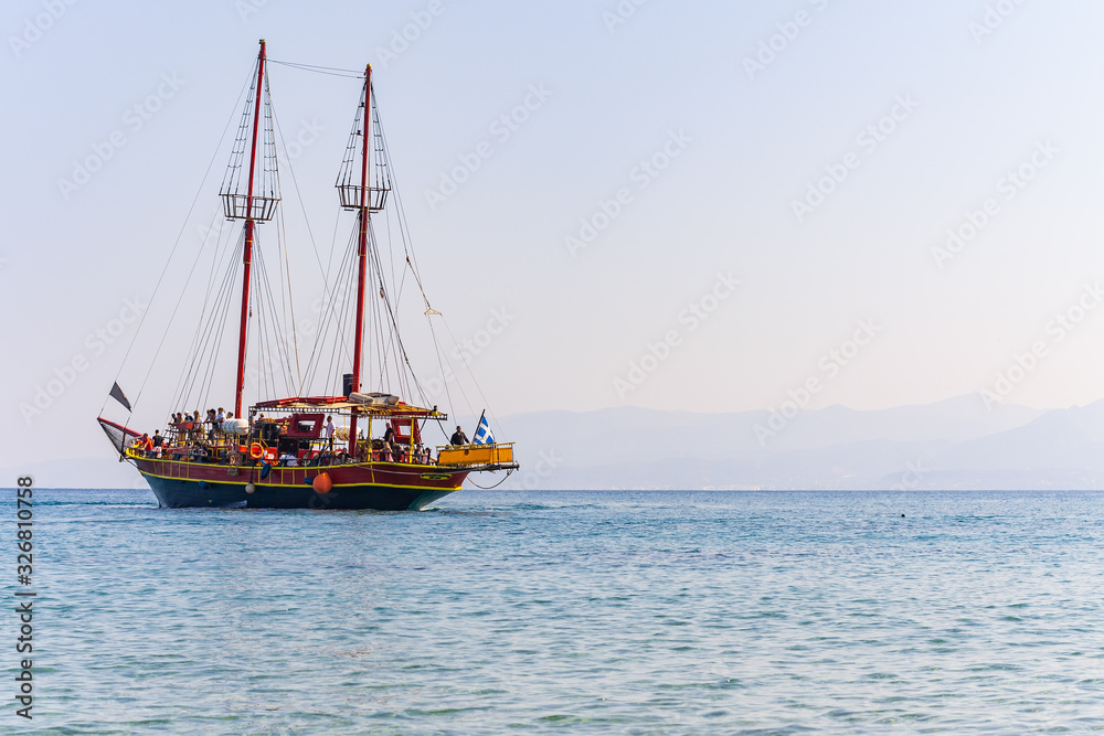 lonely ship in the Crete island beach in sunset time. Greece vacation copy space. Symbol of loneliness