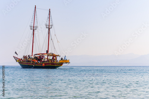 lonely ship in the Crete island beach in sunset time. Greece vacation copy space. Symbol of loneliness
