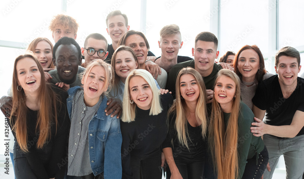 group of happy friends standing together . close up. group of happy friends standing together . close up.
