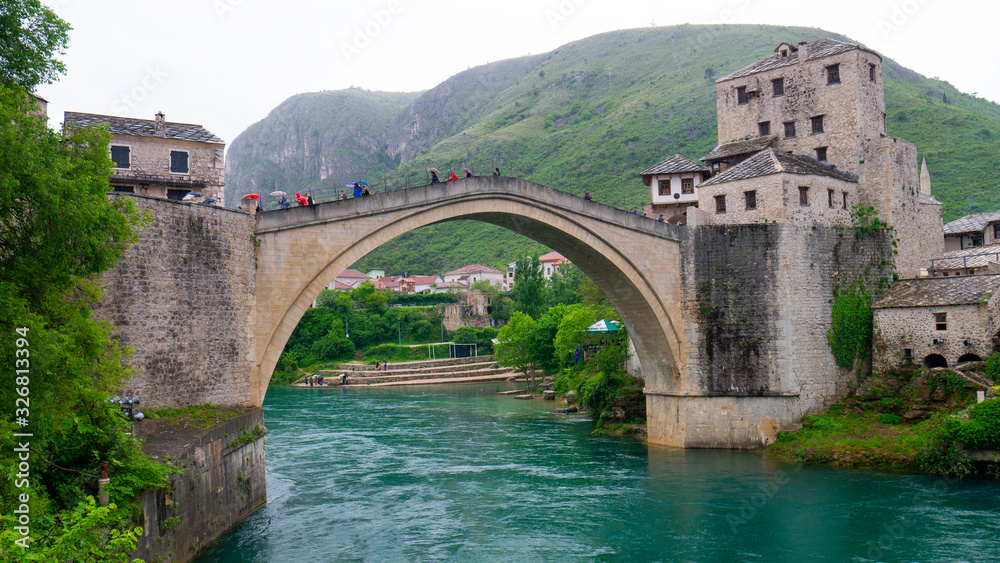 Mostar, Bosnia and Herzegovina, April 2019: Old bridge in Mostar on a cold day.