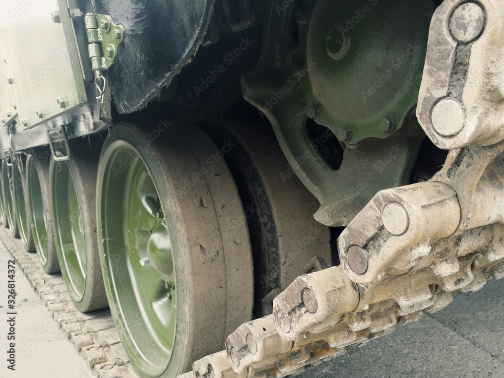 Tracked chassis of military machine running gear on road. Tracked chassis of military machine running gear on road.