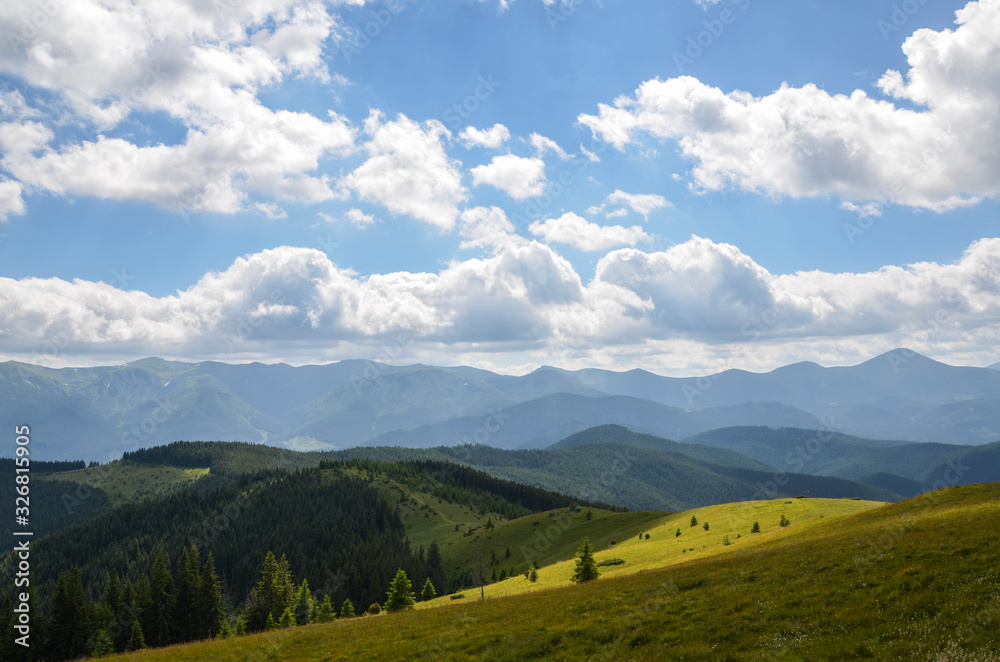 Nice view of the green hills which glowing by sunlight. Picturesque Carpathian mountains landscape, panorama view of the Chornogora ridge, Ukraine Europe. Artistic picture. Beauty world.