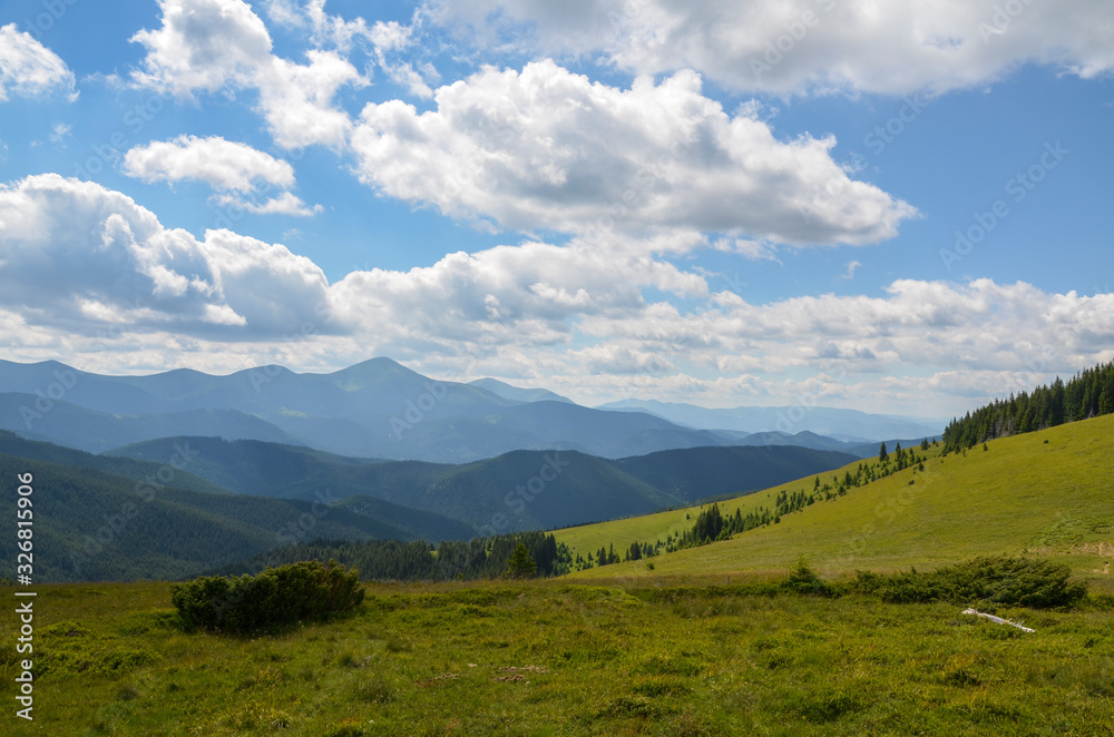Fototapeta premium Nice view of the green hills which glowing by sunlight. Picturesque Carpathian mountains landscape, panorama view of the Chornogora ridge, Ukraine Europe. Artistic picture. Beauty world.