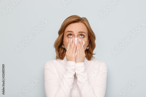 adult, background, beautiful woman, blue background, carefree, casual woman, caucasian, charming, cheerful, closeup, copy space, cute, enjoy, european, expression, expressive, face, face expression, f