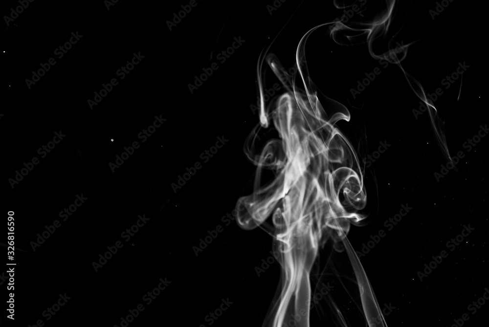Picture of white cigar smoke in black view Picture of white cigar smoke in black view