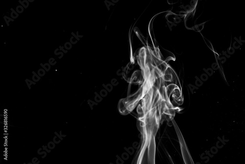 Fototapeta Naklejka Na Ścianę i Meble -  Picture of white cigar smoke in black view