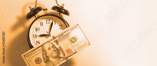Принти на полотні Time to make money. Alarmclock with Dollars cash